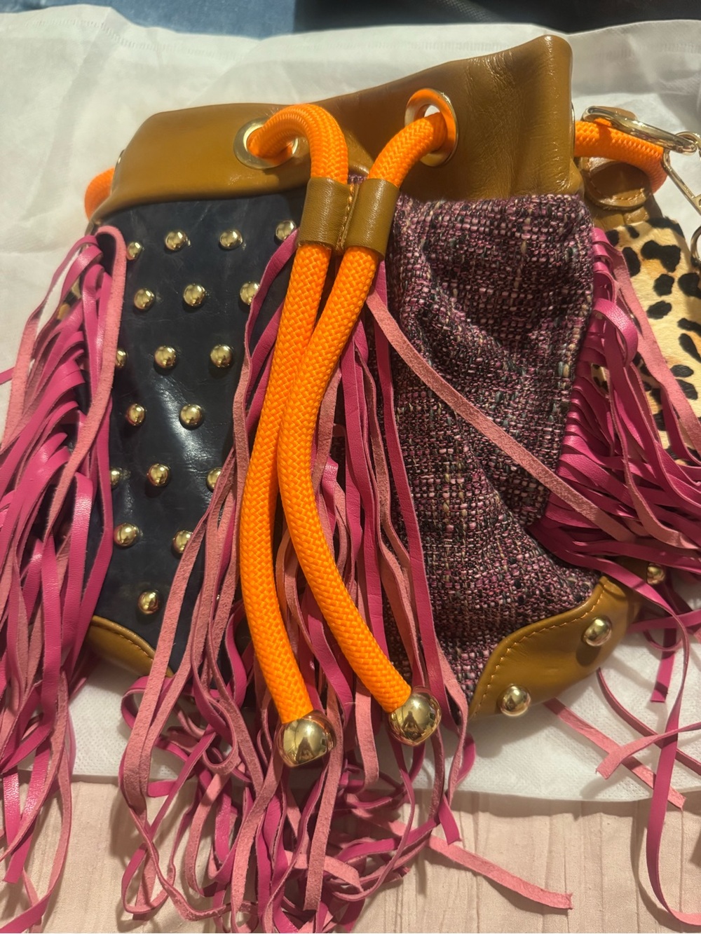 Womenโs Fringe Drawstring Bucket Bag in Pink, Orange and Tan